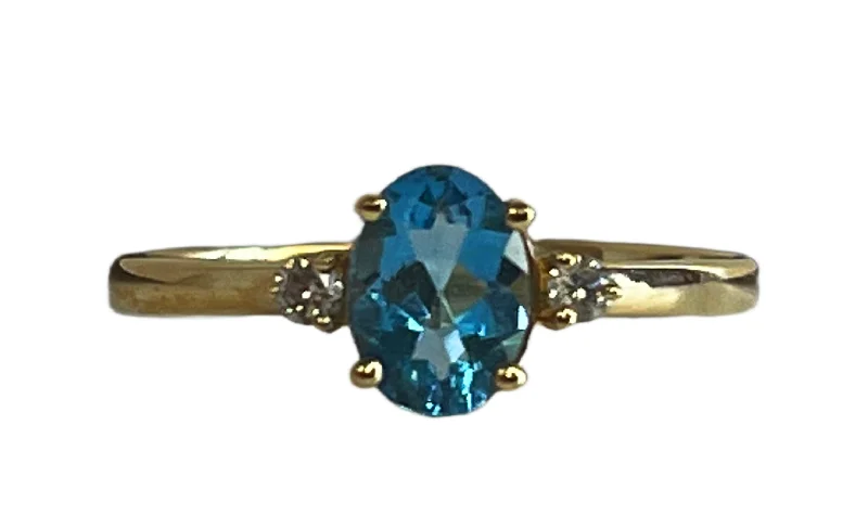 14k Yellow Gold .93ct oval Blue Topaz & .06cttw Diamond Ring