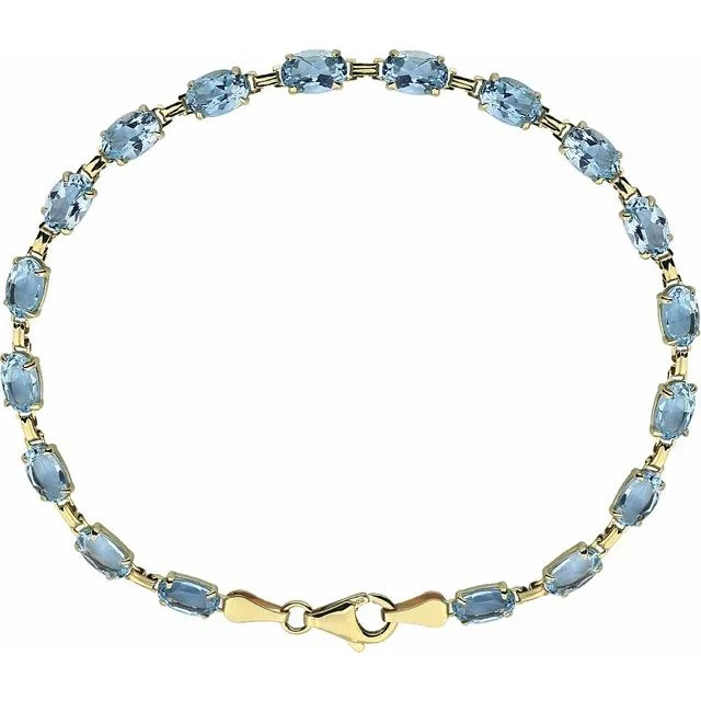 14KT YELLOW GOLD SKY BLUE TOPAZ BRACELET - 7.25"